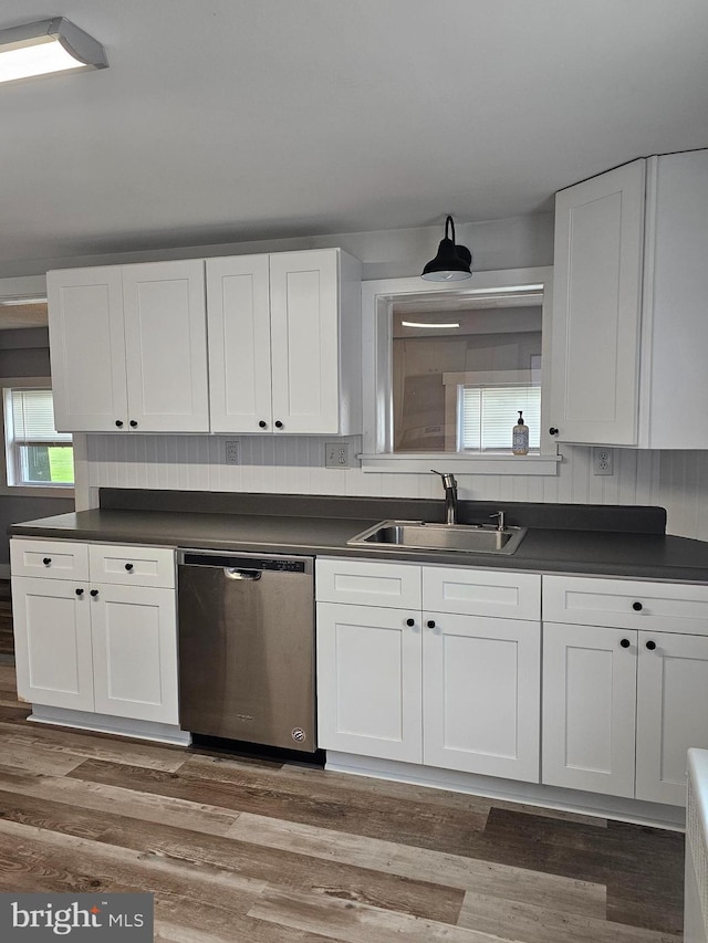 10992 Roxbury Rd, Orrstown, PA 17244 - kitchen featuring stainless steel dishwasher, a sink, dark countertops, and white cabinetry