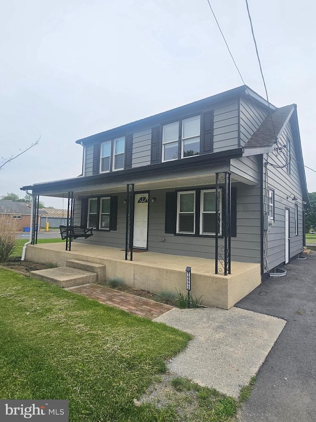 10992 Roxbury Rd, Orrstown, PA 17244 - view of front of property featuring covered porch and a front yard