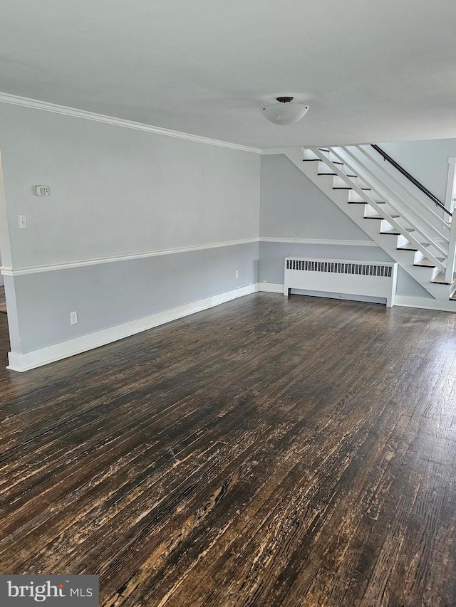 10992 Roxbury Rd, Orrstown, PA 17244 - unfurnished living room with radiator, crown molding, stairway, hardwood / wood-style flooring, and baseboards