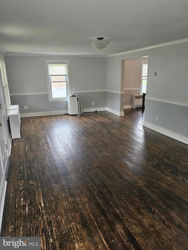 10992 Roxbury Rd, Orrstown, PA 17244 - unfurnished living room with radiator, crown molding, wood-type flooring, and baseboards