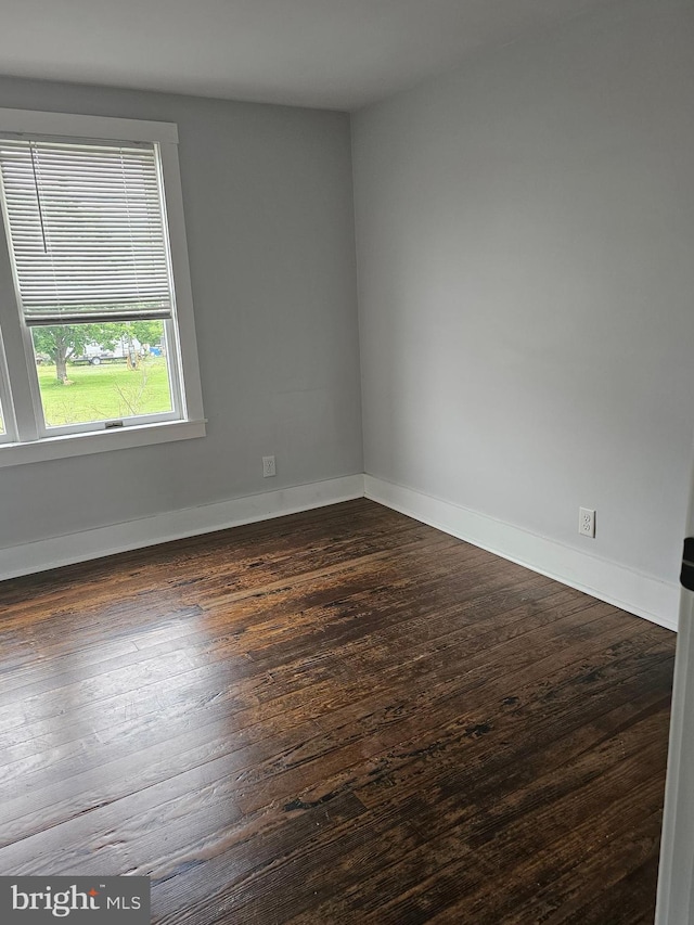 10992 Roxbury Rd, Orrstown, PA 17244 - empty room with dark wood-style flooring and baseboards