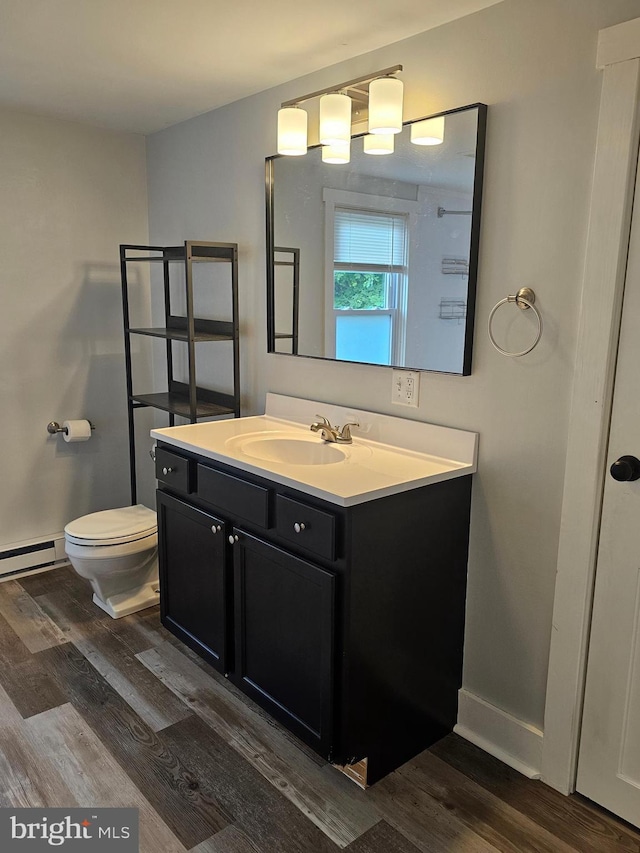 10992 Roxbury Rd, Orrstown, PA 17244 - bathroom featuring wood finished floors, toilet, vanity, and baseboards