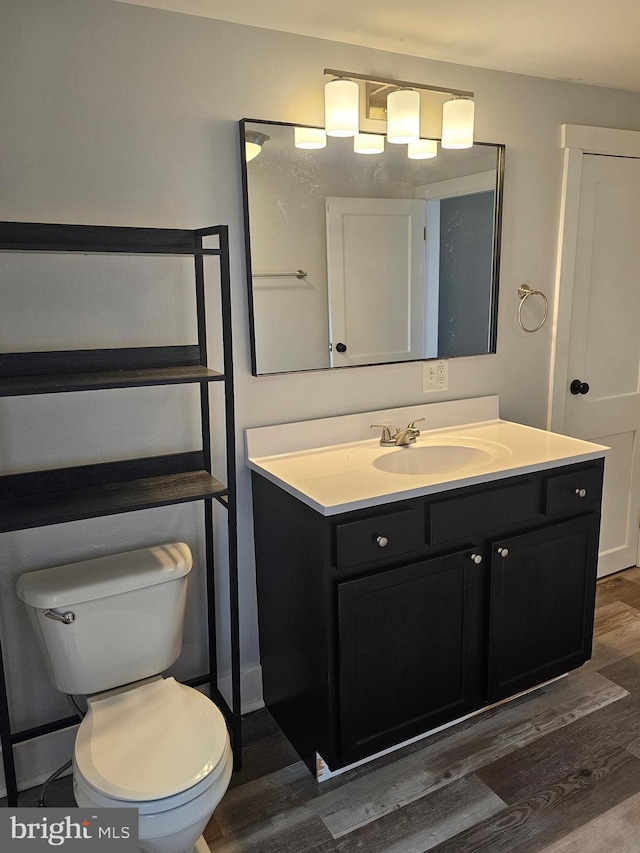 10992 Roxbury Rd, Orrstown, PA 17244 - bathroom featuring wood finished floors, toilet, and vanity