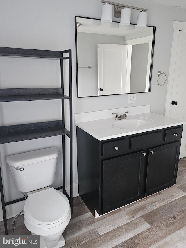 10992 Roxbury Rd, Orrstown, PA 17244 - bathroom featuring wood finished floors, toilet, and vanity