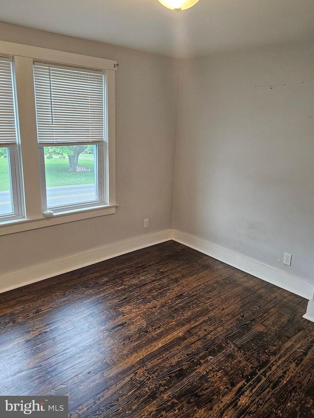 10992 Roxbury Rd, Orrstown, PA 17244 - empty room featuring plenty of natural light, dark wood-style flooring, and baseboards