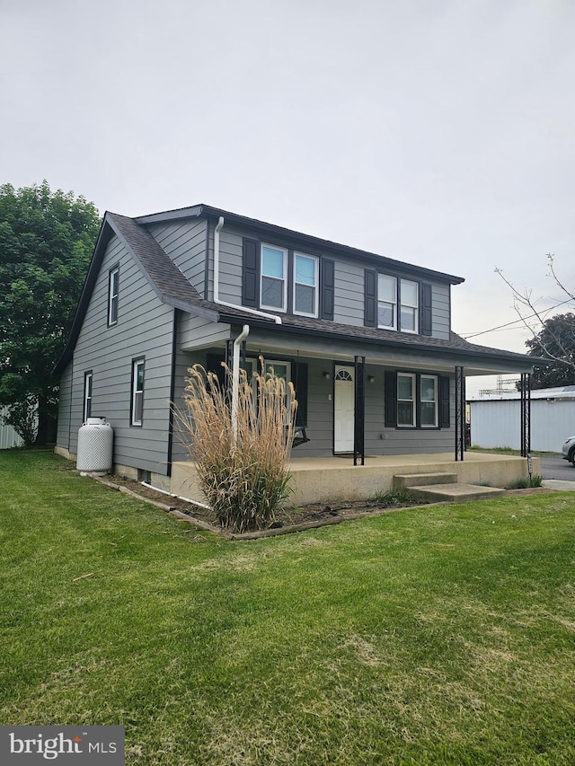 10992 Roxbury Rd, Orrstown, PA 17244 - traditional home with a front lawn, covered porch, and a carport