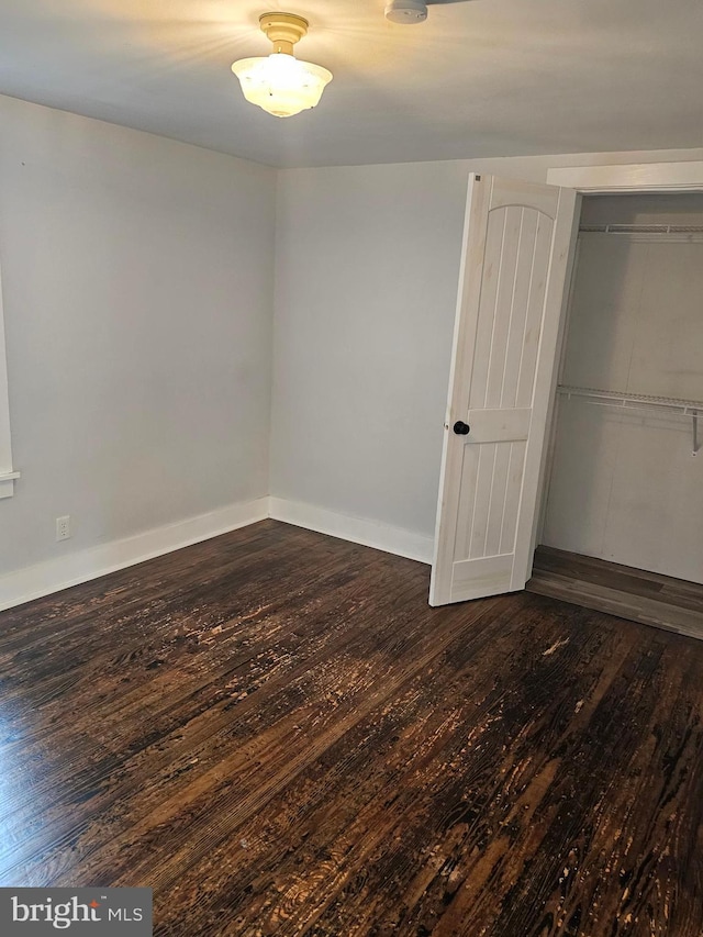 10992 Roxbury Rd, Orrstown, PA 17244 - unfurnished bedroom with wood-type flooring, baseboards, and a closet
