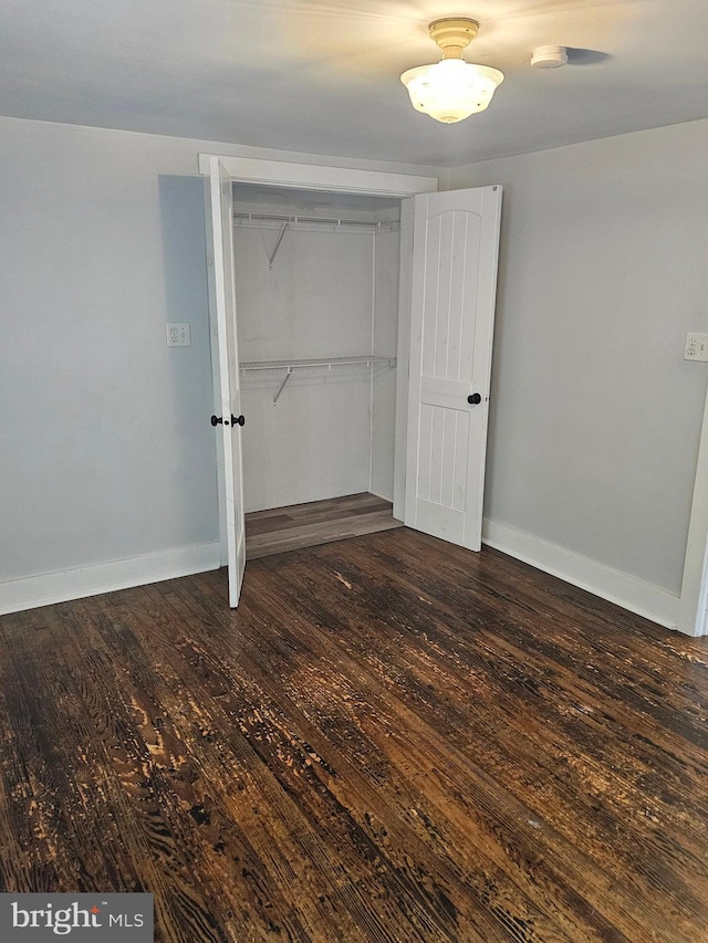 10992 Roxbury Rd, Orrstown, PA 17244 - unfurnished bedroom featuring wood finished floors, baseboards, and a closet
