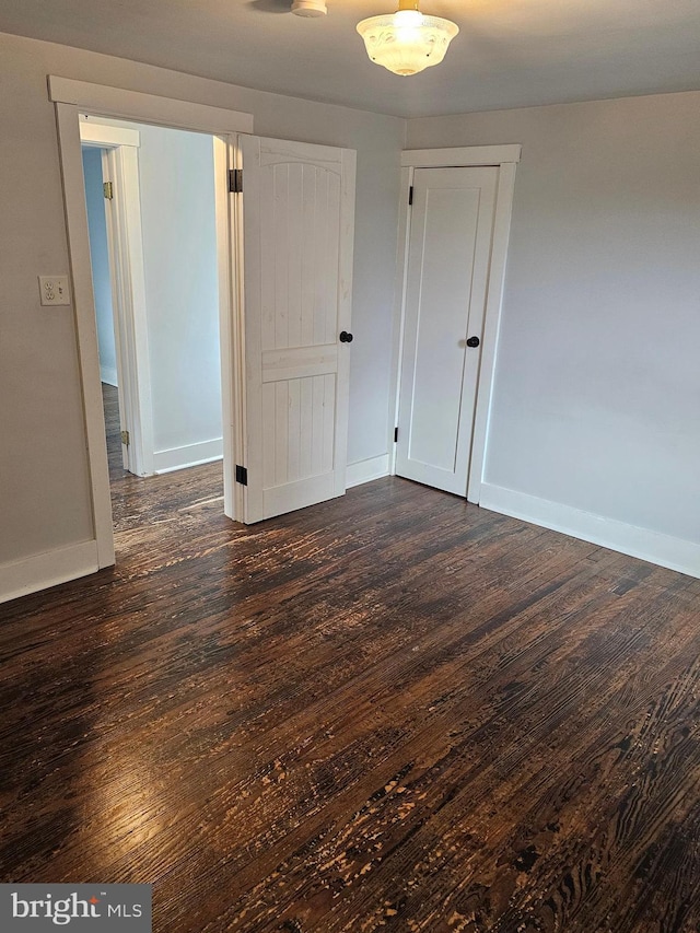 10992 Roxbury Rd, Orrstown, PA 17244 - empty room featuring dark wood-type flooring and baseboards