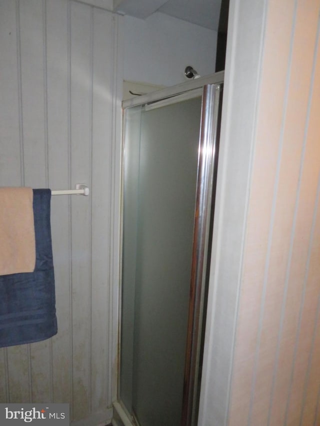 full bath featuring a shower stall