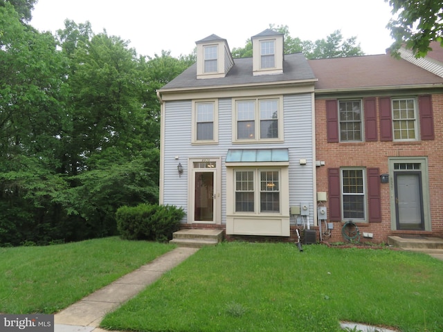 view of front of property with a front lawn
