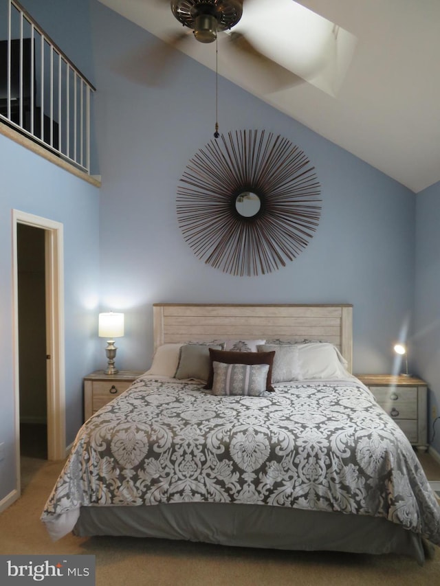 bedroom featuring carpet flooring and high vaulted ceiling