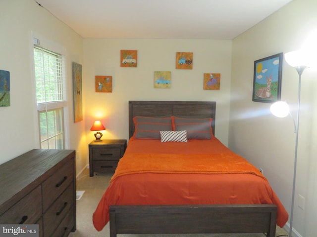 bedroom with baseboards and carpet flooring