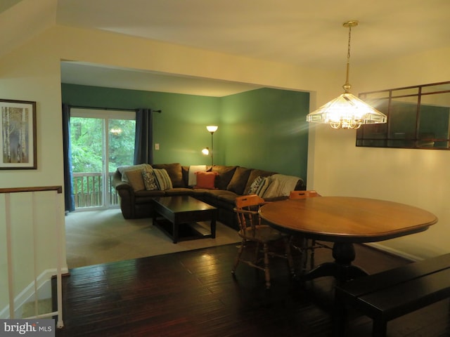 dining space featuring a chandelier and hardwood / wood-style floors