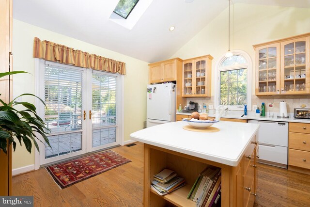 9841 Meadowcroft Ln, Montgomery Village, MD 20886 - kitchen with white appliances, open shelves, light countertops, a skylight, and light wood-style flooring