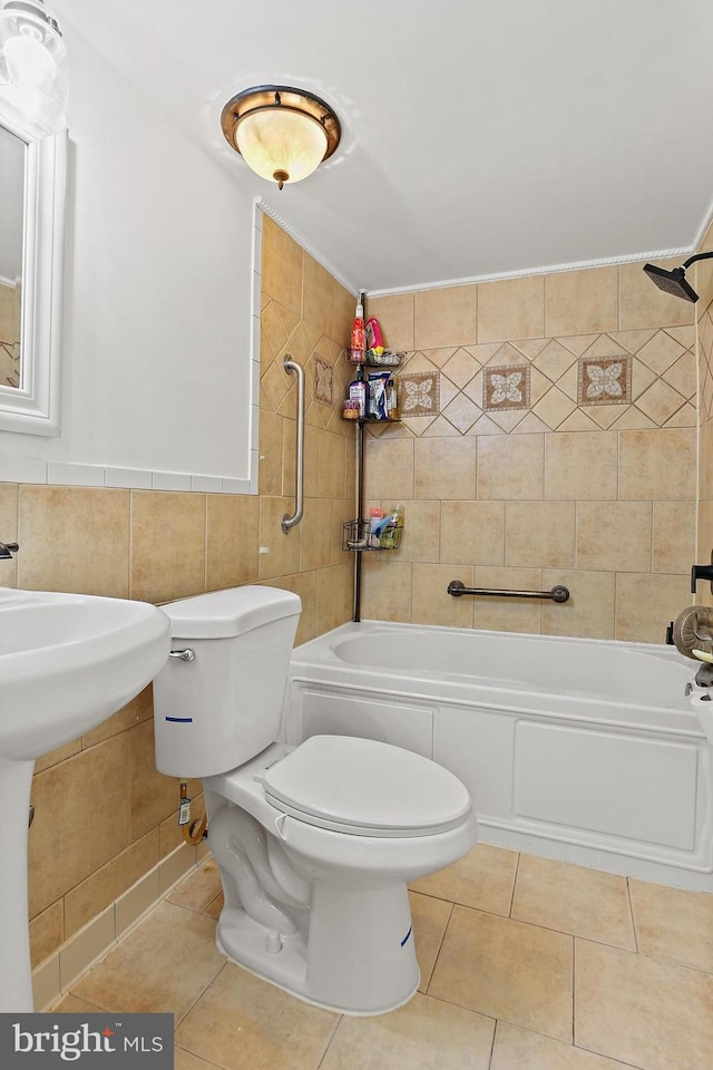 10816 Green Mountain Cir Unit 19-10, Columbia, MD 21044 - bathroom featuring tile walls, tile patterned floors, toilet,  shower combination, and a sink