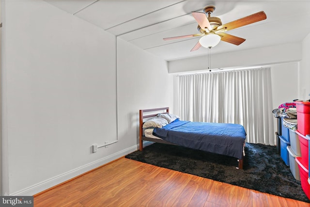 10816 Green Mountain Cir Unit 19-10, Columbia, MD 21044 - bedroom with wood finished floors, baseboards, and ceiling fan