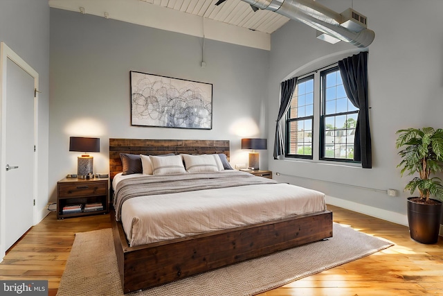 200 Lincoln Ave Unit 304, Phoenixville, PA 19460 - bedroom with wood finished floors, beam ceiling, high vaulted ceiling, and baseboards