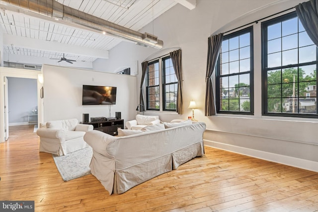 200 Lincoln Ave Unit 304, Phoenixville, PA 19460 - living room featuring hardwood / wood-style flooring, healthy amount of natural light, baseboards, high vaulted ceiling, and wooden ceiling with exposed beams