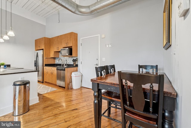 200 Lincoln Ave Unit 304, Phoenixville, PA 19460 - dining room featuring a towering ceiling and light wood-type flooring