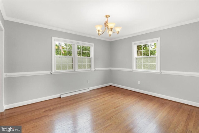 101 Flower, Mount Airy, MD 21771 - empty room featuring baseboard heating, a chandelier, plenty of natural light, wood finished floors, and crown molding