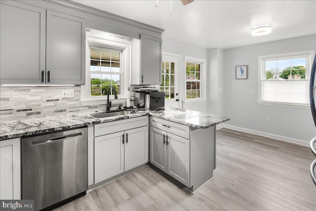 101 Flower, Mount Airy, MD 21771 - kitchen featuring dishwasher, a sink, a peninsula, and plenty of natural light