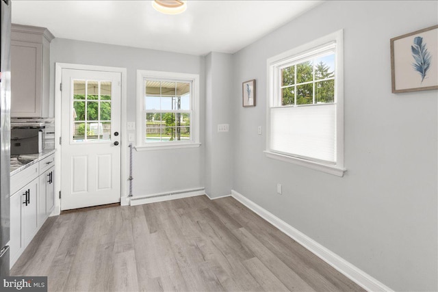 101 Flower, Mount Airy, MD 21771 - entryway featuring light wood finished floors, baseboards, and a baseboard heating unit