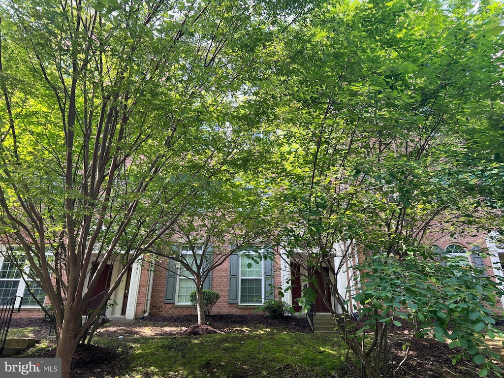 view of front of home featuring brick siding