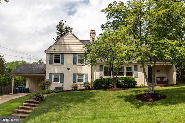 3663 Trinity, Alexandria, VA 22304 - view of front facade with a chimney, brick siding, and a front lawn