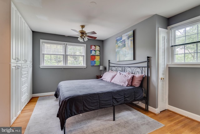 3663 Trinity, Alexandria, VA 22304 - bedroom featuring multiple windows, light wood-style floors, and baseboards