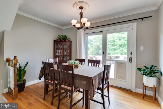 3663 Trinity, Alexandria, VA 22304 - dining area featuring crown molding, a chandelier, light wood-style floors, and baseboards