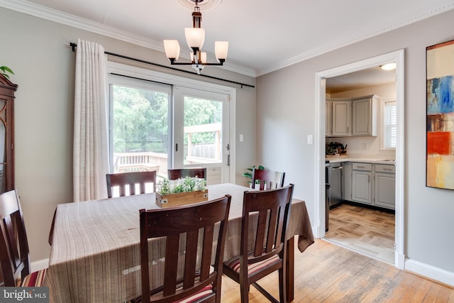 3663 Trinity, Alexandria, VA 22304 - dining space featuring a chandelier, crown molding, baseboards, and light wood-style flooring