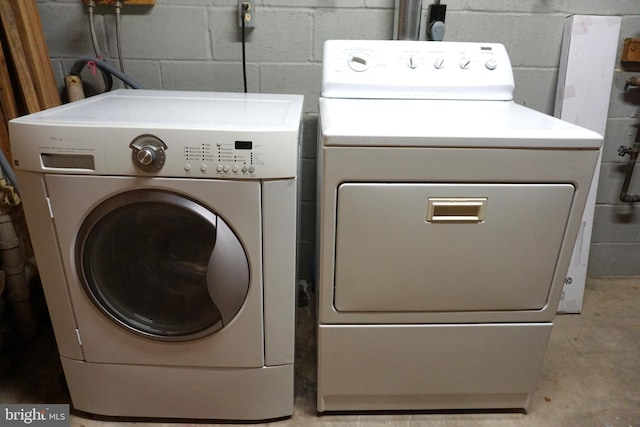 3506 Split Rail Ln, Ellicott City, MD 21042 - washroom featuring separate washer and dryer and concrete block wall