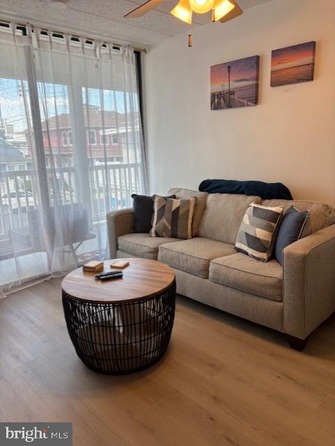 9415 Pacific Ave Unit 43, Margate City, NJ 08402 - living area with wood finished floors and a ceiling fan