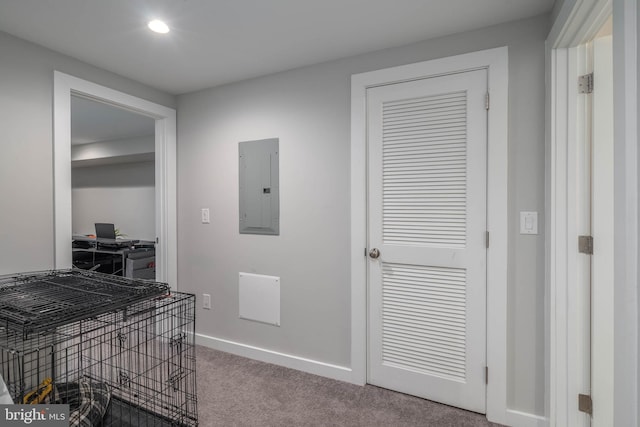 corridor with electric panel, carpet flooring, baseboards, an office area, and recessed lighting