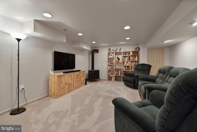 1839 Disney Estates Cir, Severn, MD 21144 - living room with light colored carpet, a wood stove, and recessed lighting