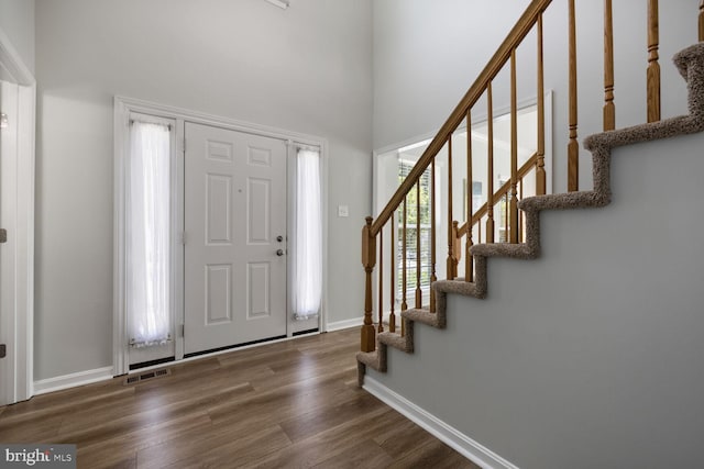 1839 Disney Estates Cir, Severn, MD 21144 - foyer featuring stairway, wood finished floors, and a high ceiling