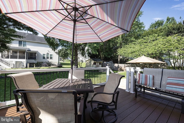 1839 Disney Estates Cir, Severn, MD 21144 - deck with outdoor dining area and a shed