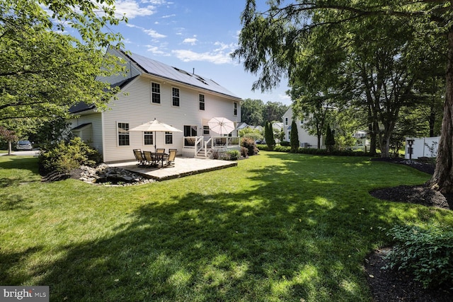 1839 Disney Estates Cir, Severn, MD 21144 - view of green lawn with a patio