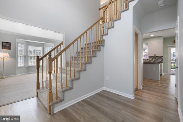 1839 Disney Estates Cir, Severn, MD 21144 - stairs featuring wood finished floors, plenty of natural light, and a high ceiling