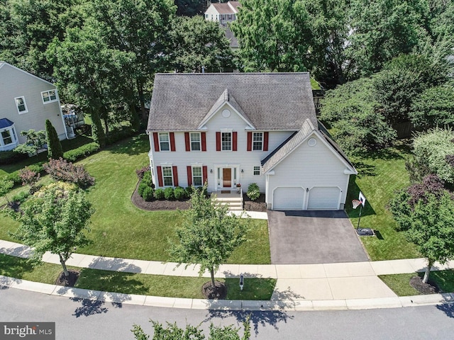 1839 Disney Estates Cir, Severn, MD 21144 - colonial home featuring a garage, asphalt driveway, and a front lawn
