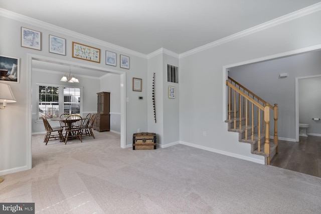 1839 Disney Estates Cir, Severn, MD 21144 - carpeted entryway featuring ornamental molding, a chandelier, and stairs