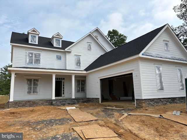 3608 Center Dr, Alexandria, VA 22309 - view of front of house featuring a garage, a porch, and stone siding