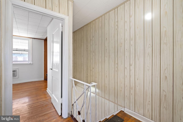 6602 Revere St, Philadelphia, PA 19149 - hall with an upstairs landing, wood finished floors, wood walls, baseboards, and a wall mounted air conditioner