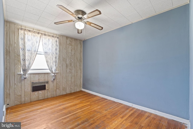 6602 Revere St, Philadelphia, PA 19149 - unfurnished room with wood finished floors, a ceiling fan, baseboards, and wooden walls