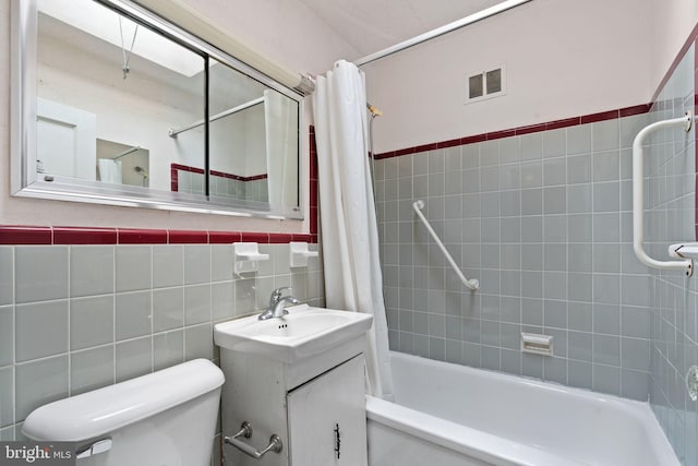 6602 Revere St, Philadelphia, PA 19149 - full bath featuring tile walls, shower / tub combo, toilet, and vanity