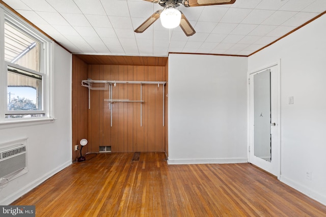 6602 Revere St, Philadelphia, PA 19149 - spare room with hardwood / wood-style floors, ceiling fan, baseboards, a wall mounted AC, and crown molding