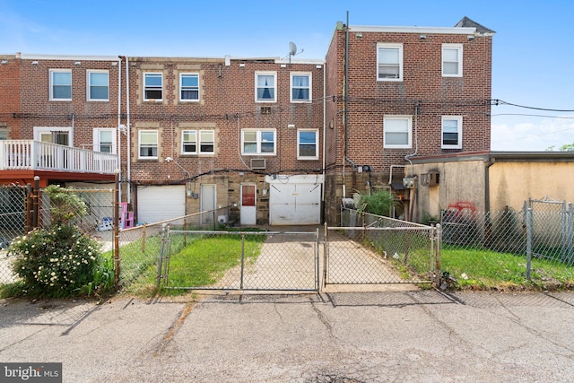 6602 Revere St, Philadelphia, PA 19149 - back of property featuring a garage, concrete driveway, a gate, and fence