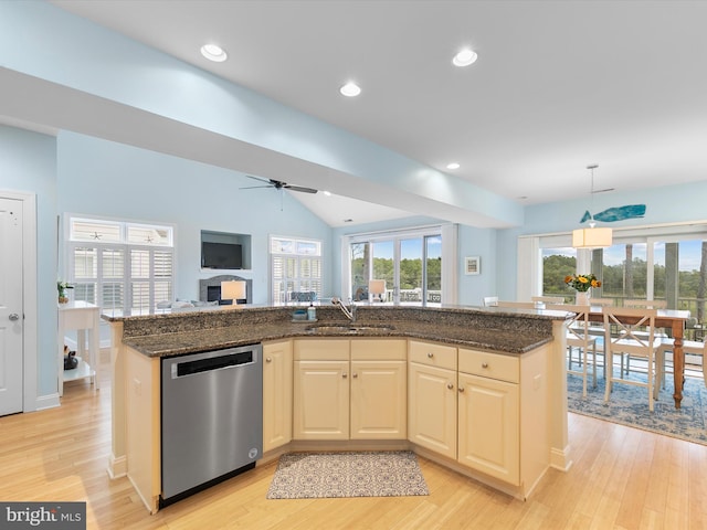 32561 Heron Cir Unit 13, Bethany Beach, DE 19930 - kitchen featuring stainless steel dishwasher, a sink, light wood-type flooring, open floor plan, and healthy amount of natural light