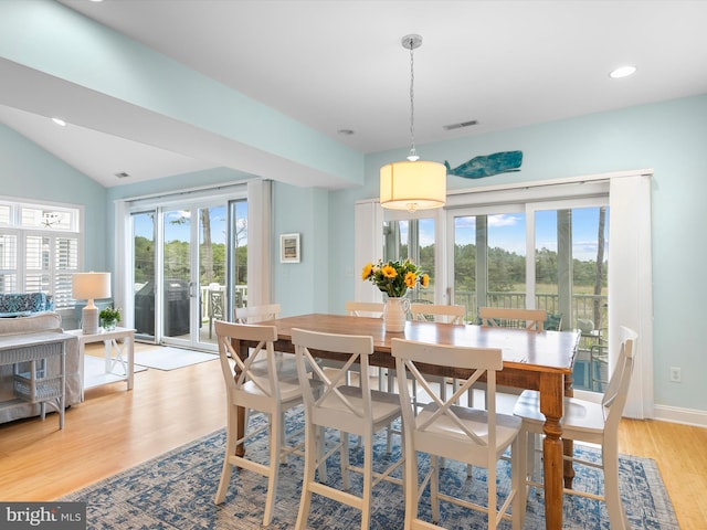 32561 Heron Cir Unit 13, Bethany Beach, DE 19930 - dining area with light wood-type flooring, plenty of natural light, recessed lighting, vaulted ceiling, and baseboards
